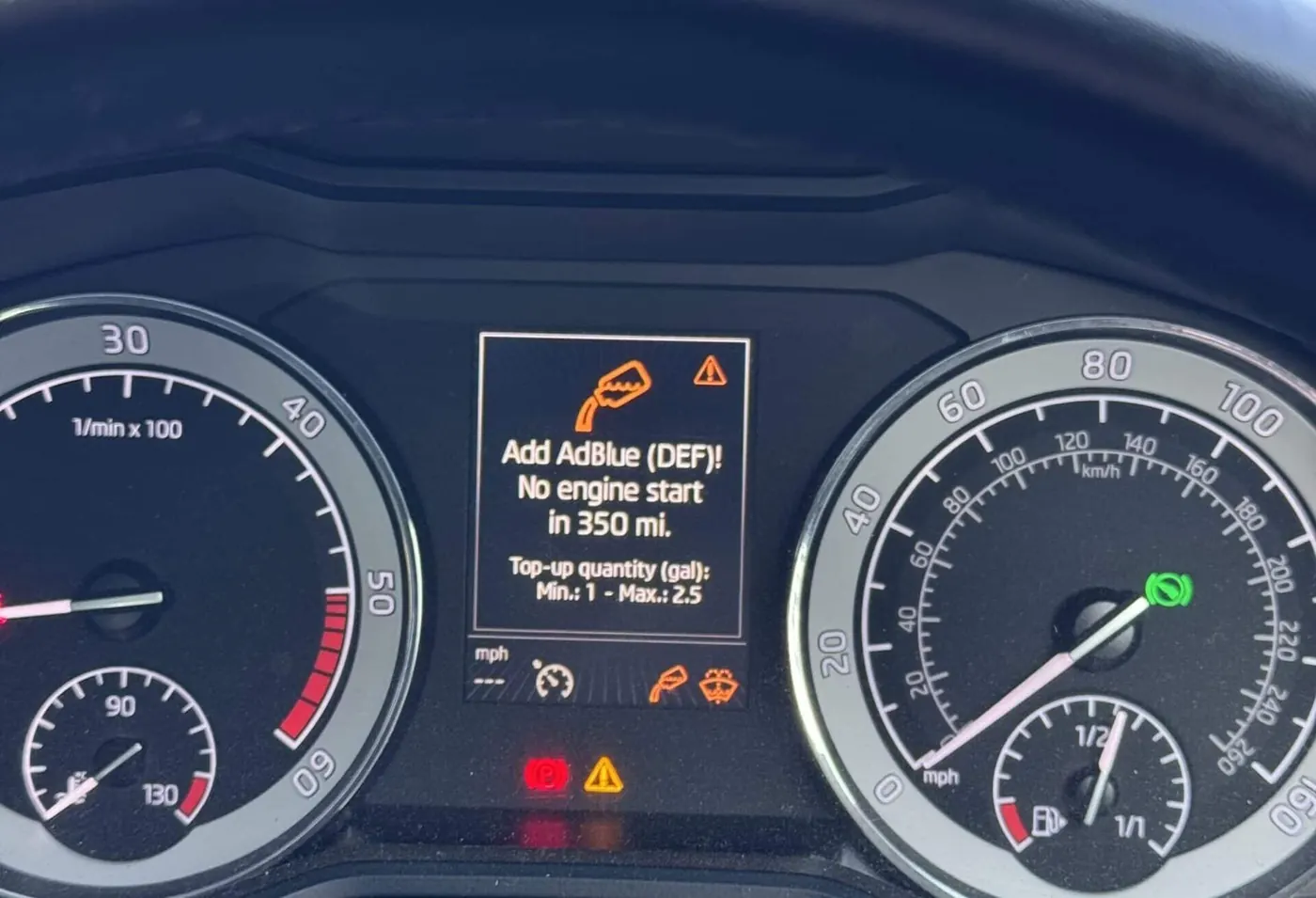 Skoda dashboard showing the AdBlue warning: Add AdBlue (DEF), no engine start in 350 miles.